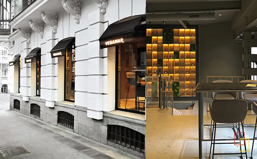 Detalle del espacio Vegamar en Madrid con botellas de vino y zona de catas